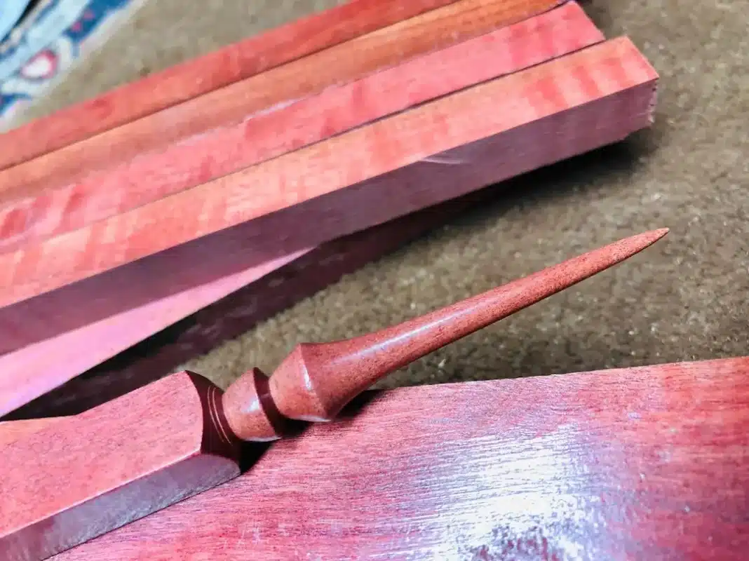 Pink ivory wood showing pinkish-brown to deep maroon color variations